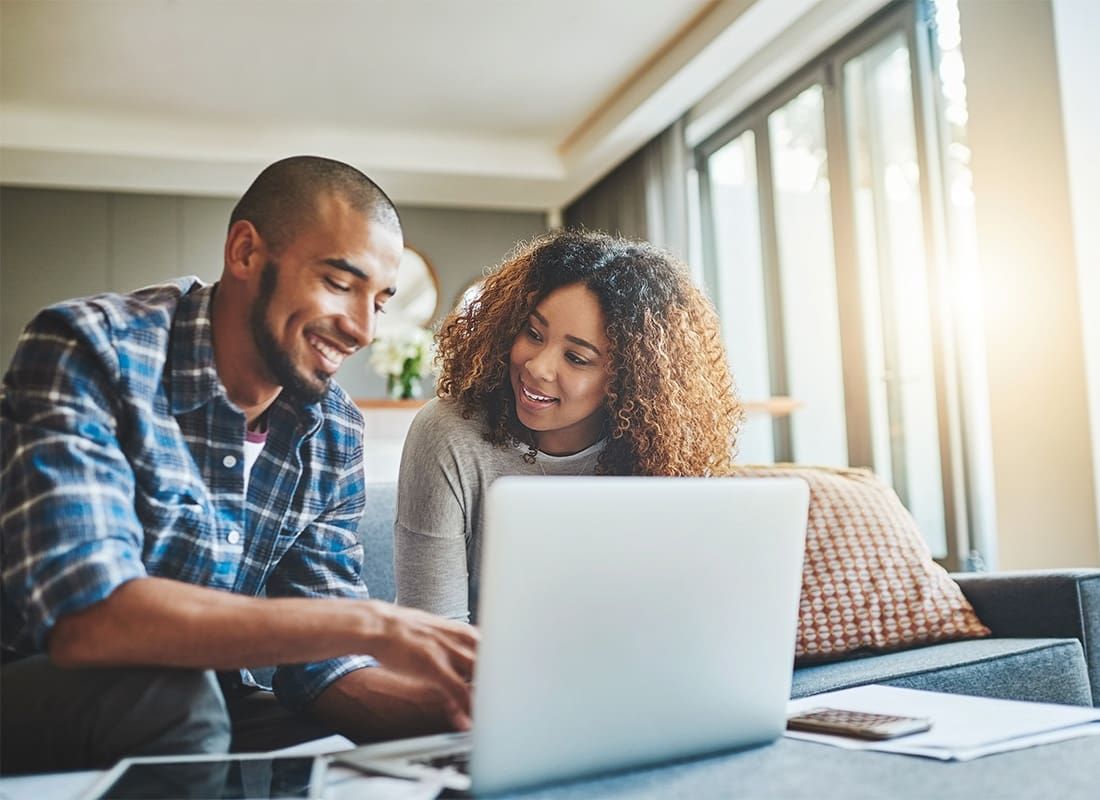 Service Center - Young Couple Planning Financial Future Together at Home