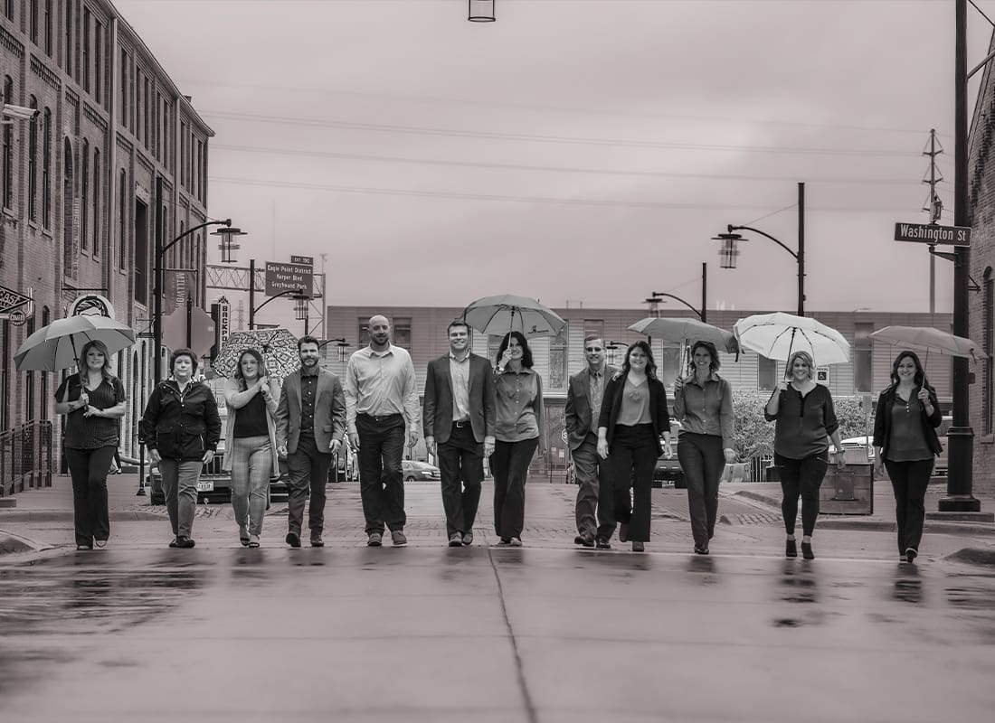 About Our Agency - Group Photo With Umbrella